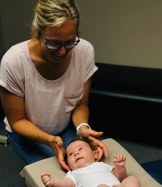 Chiropractor Slinger WI Trista Bringa Adjusting Baby