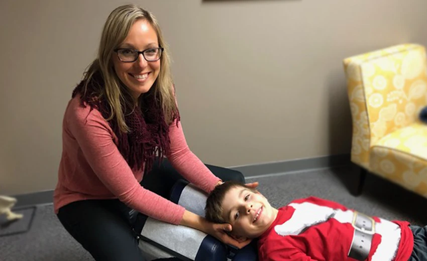 Chiropractor Slinger WI Trista Bringa Adjusting Boy